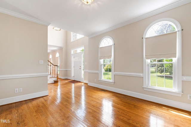 2464 Village Of Wakefield Dr, Zebulon, NC 27597 - entrance foyer with ornamental molding, wood finished floors, and stairs
