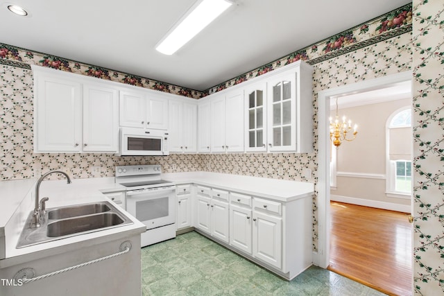 2464 Village Of Wakefield Dr, Zebulon, NC 27597 - kitchen with white appliances, white cabinetry, and light flooring