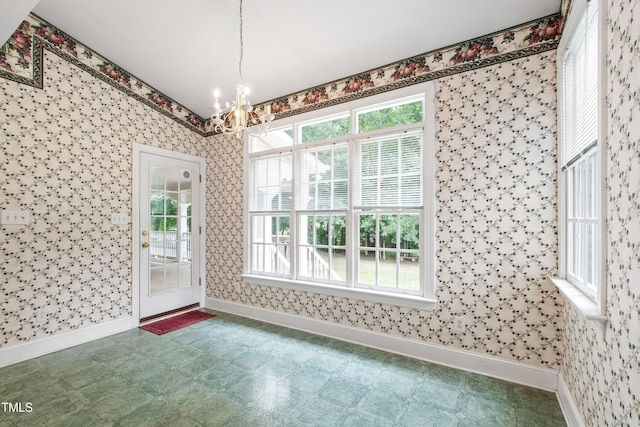 2464 Village Of Wakefield Dr, Zebulon, NC 27597 - unfurnished dining area with a chandelier, healthy amount of natural light, and wallpapered walls
