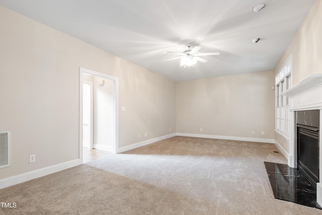 2464 Village Of Wakefield Dr, Zebulon, NC 27597 - unfurnished living room with carpet, a ceiling fan, and a high end fireplace