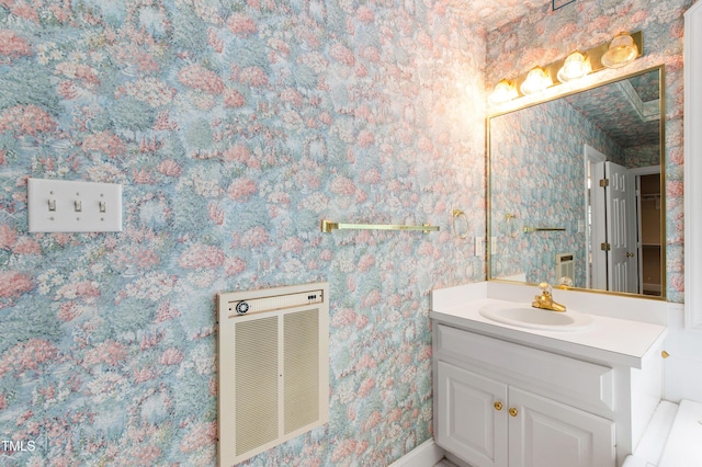 2464 Village Of Wakefield Dr, Zebulon, NC 27597 - bathroom featuring vanity and wallpapered walls