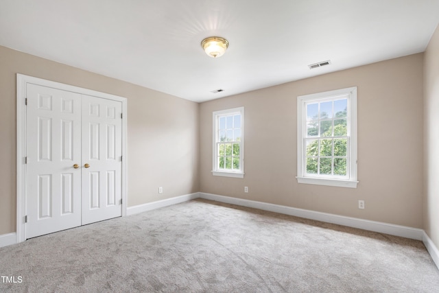 2464 Village Of Wakefield Dr, Zebulon, NC 27597 - unfurnished bedroom featuring carpet floors and a closet