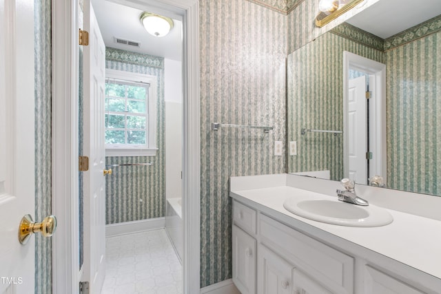 2464 Village Of Wakefield Dr, Zebulon, NC 27597 - bathroom featuring vanity, wallpapered walls, and bathing tub / shower combination