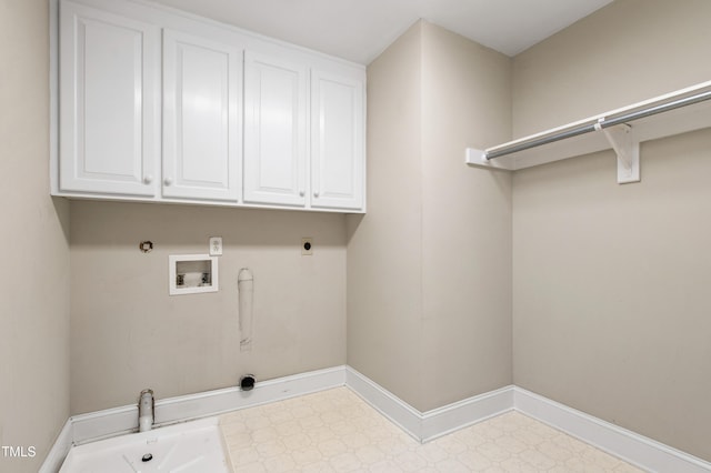2464 Village Of Wakefield Dr, Zebulon, NC 27597 - laundry room featuring gas dryer hookup, hookup for an electric dryer, washer hookup, tile patterned floors, and cabinet space