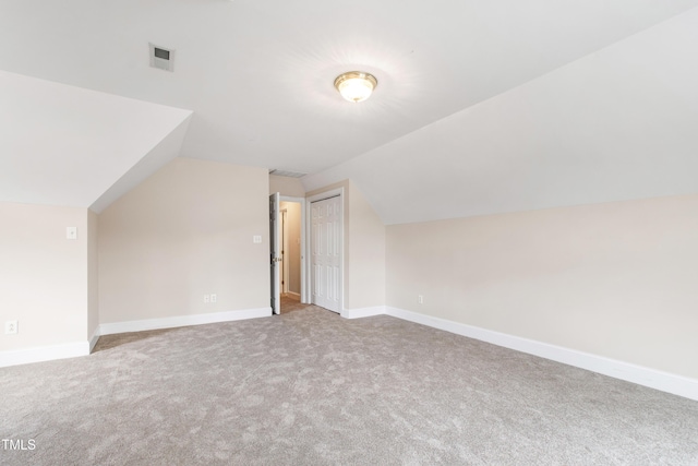 2464 Village Of Wakefield Dr, Zebulon, NC 27597 - additional living space with vaulted ceiling and carpet flooring