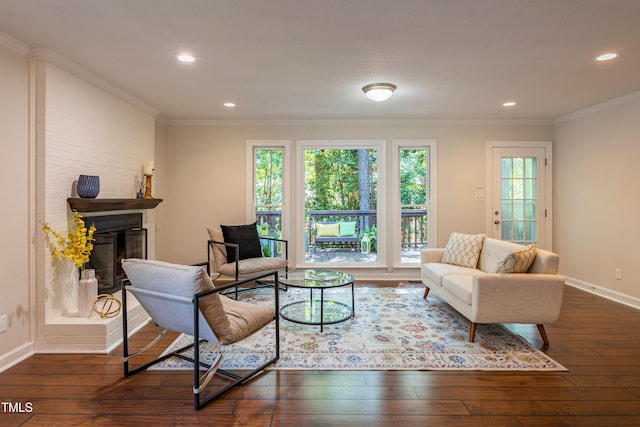 104 Silver Fox Ct, Cary, NC 27511 - living area featuring dark wood-type flooring, a fireplace with raised hearth, ornamental molding, and recessed lighting