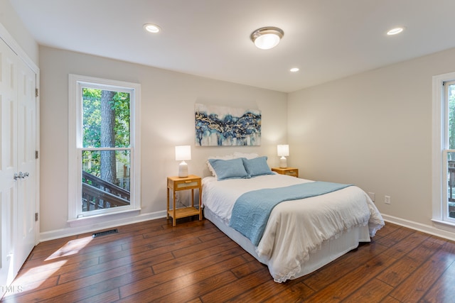 104 Silver Fox Ct, Cary, NC 27511 - bedroom with multiple windows, hardwood / wood-style flooring, and recessed lighting