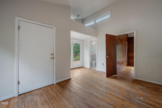 1310 Martin Luther King Pkwy, Durham, NC 27707 - unfurnished room featuring wood finished floors and a towering ceiling