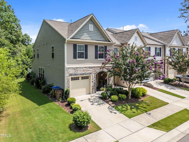 3801 Windsnap Dr, Wake Forest, NC 27587 - craftsman inspired home featuring concrete driveway, a front yard, stone siding, and an attached garage