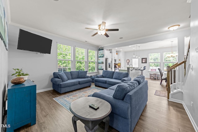 3801 Windsnap Dr, Wake Forest, NC 27587 - living area featuring ceiling fan, ornamental molding, a chandelier, and wood finished floors