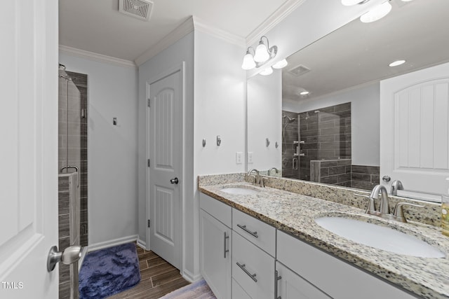 3801 Windsnap Dr, Wake Forest, NC 27587 - full bathroom with double vanity, a stall shower, wood finished floors, and ornamental molding