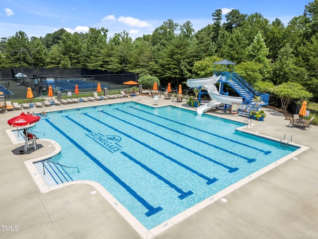 3801 Windsnap Dr, Wake Forest, NC 27587 - community pool featuring a water slide and a patio area