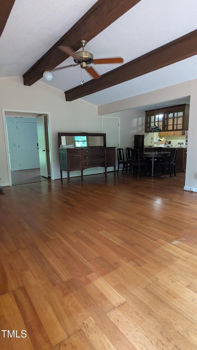11636 Appaloosa Run W, Raleigh, NC 27613 - unfurnished living room featuring wood finished floors and ceiling fan