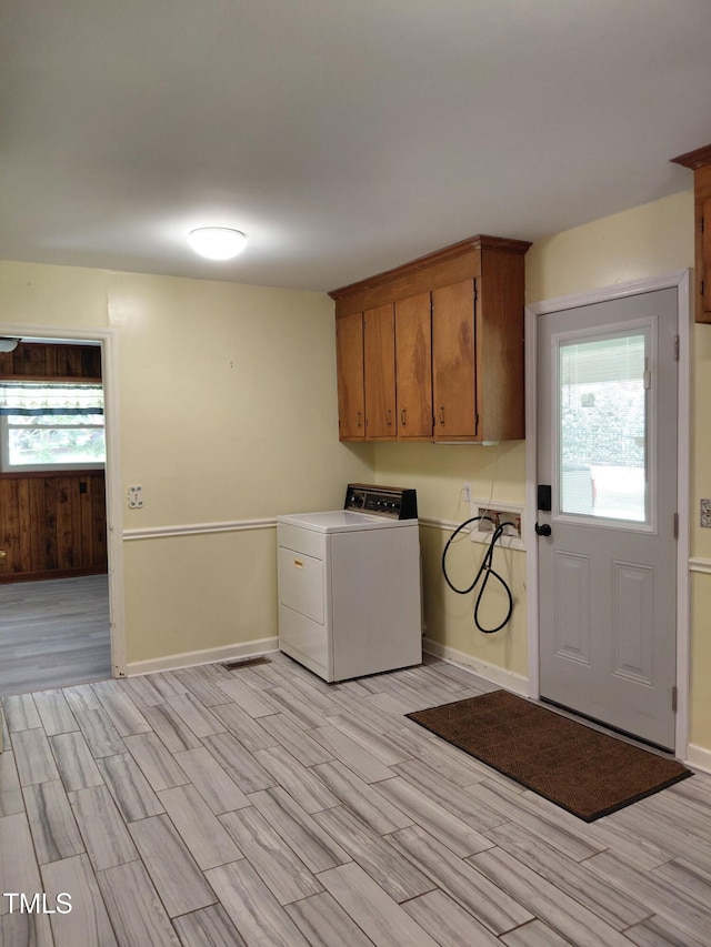 11636 Appaloosa Run W, Raleigh, NC 27613 - laundry area with washer / clothes dryer, wood finish floors, and cabinet space