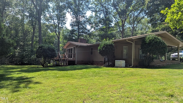 11636 Appaloosa Run W, Raleigh, NC 27613 - rear view of house with crawl space, stairway, a lawn, a chimney, and a deck
