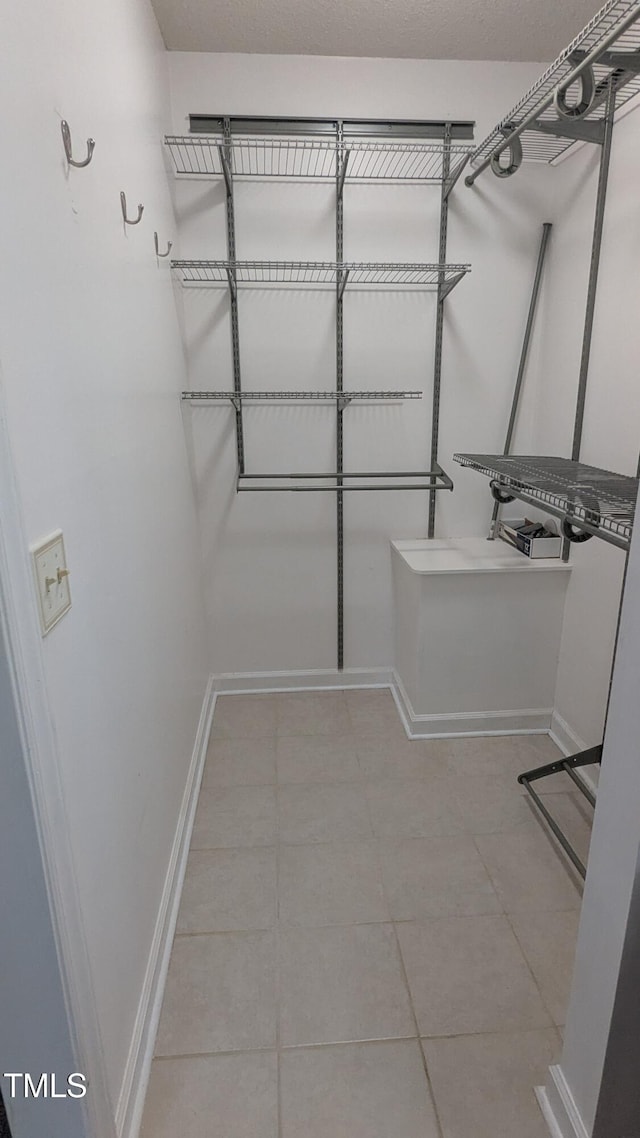 11636 Appaloosa Run W, Raleigh, NC 27613 - walk in closet featuring tile patterned flooring