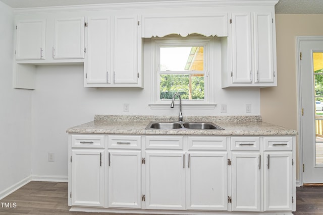 204 Mercer Ct, Goldsboro, NC 27530 - kitchen featuring white cabinetry, dark wood-style flooring, and light stone countertops