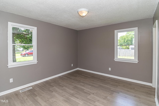 204 Mercer Ct, Goldsboro, NC 27530 - unfurnished room featuring wood finished floors and a textured ceiling
