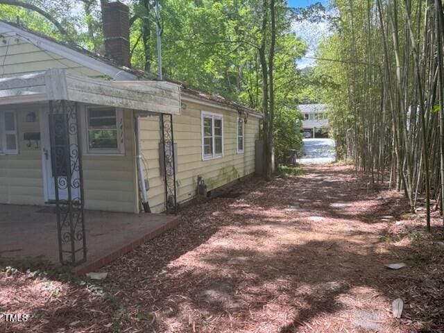 1414 Vickers Ave, Durham, NC 27707 - view of side of home featuring a chimney
