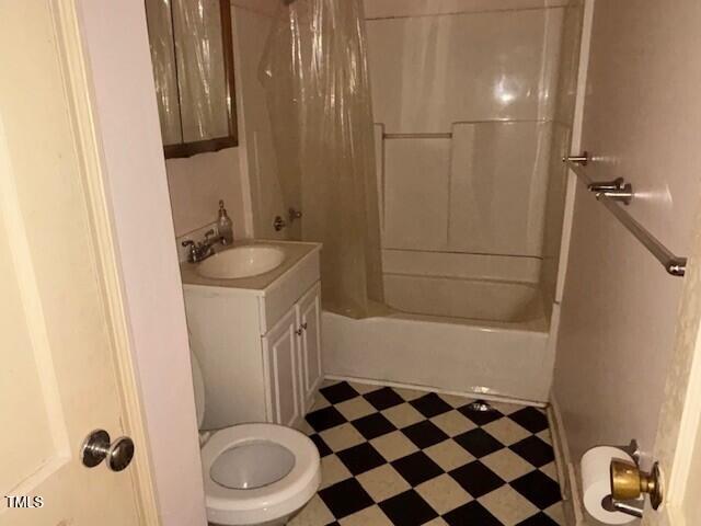 1414 Vickers Ave, Durham, NC 27707 - bathroom featuring tile patterned floors, vanity, and shower / bath combo