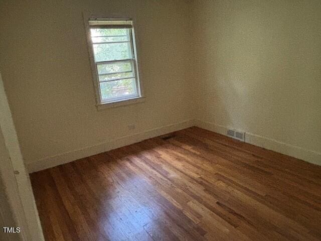 1414 Vickers Ave, Durham, NC 27707 - empty room with wood finished floors and baseboards