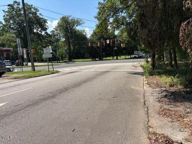 1414 Vickers Ave, Durham, NC 27707 - view of asphalt road featuring traffic signs and traffic lights