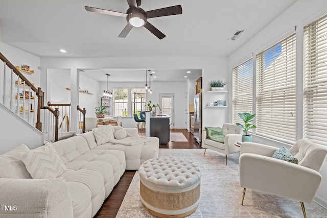 2700 Benevolence Dr, Raleigh, NC 27610 - living area with dark wood-type flooring, stairs, recessed lighting, and ceiling fan