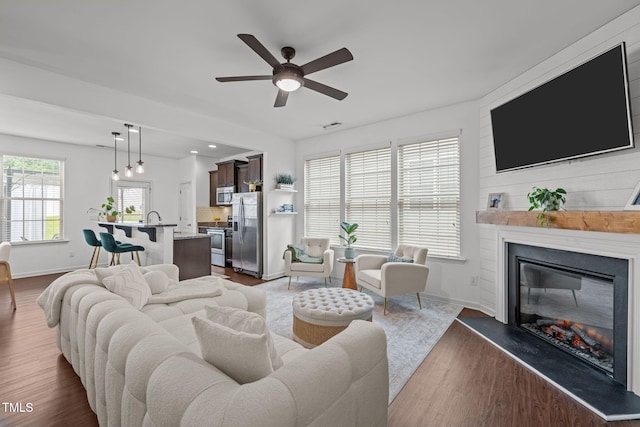 2700 Benevolence Dr, Raleigh, NC 27610 - living room with a fireplace, dark wood-type flooring, and ceiling fan