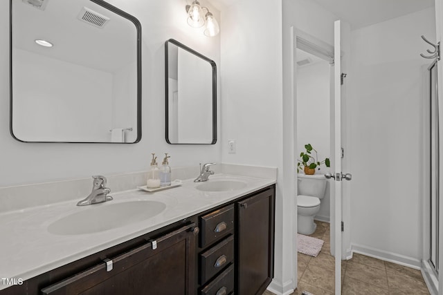 2700 Benevolence Dr, Raleigh, NC 27610 - bathroom featuring double vanity and toilet