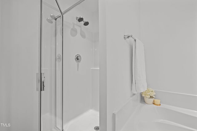 2700 Benevolence Dr, Raleigh, NC 27610 - bathroom featuring a stall shower and a bath