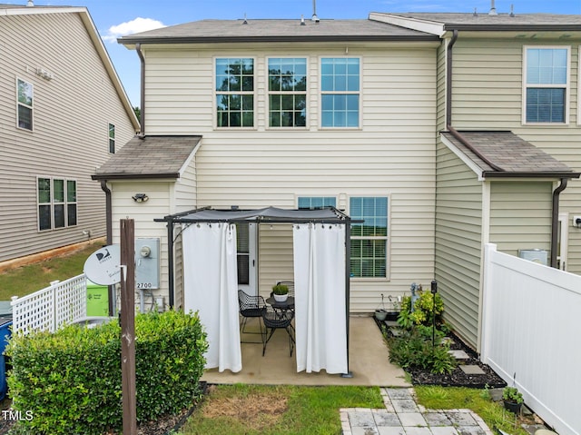 2700 Benevolence Dr, Raleigh, NC 27610 - rear view of property with a patio and a shingled roof