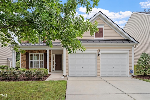 212 Oswego Ct, Morrisville, NC 27560 - traditional-style home featuring a standing seam roof, concrete driveway, a metal roof, and covered porch