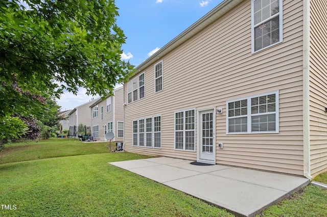 212 Oswego Ct, Morrisville, NC 27560 - back of property featuring a lawn and a patio