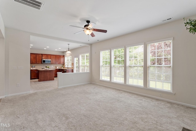 212 Oswego Ct, Morrisville, NC 27560 - unfurnished living room with ceiling fan, light carpet, and recessed lighting
