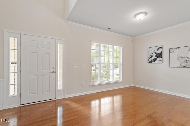 212 Oswego Ct, Morrisville, NC 27560 - foyer with crown molding and wood finished floors