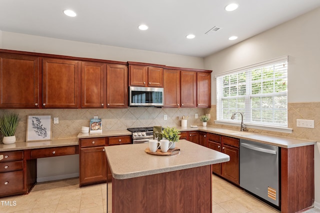 212 Oswego Ct, Morrisville, NC 27560 - kitchen featuring stainless steel appliances, light countertops, recessed lighting, decorative backsplash, and a center island