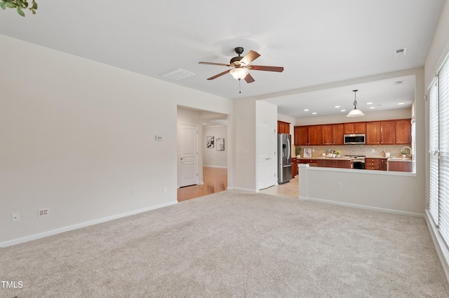 212 Oswego Ct, Morrisville, NC 27560 - unfurnished living room featuring light carpet, a ceiling fan, recessed lighting, and healthy amount of natural light