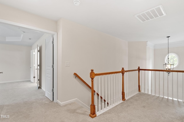 212 Oswego Ct, Morrisville, NC 27560 - corridor featuring an upstairs landing, carpet, and a chandelier