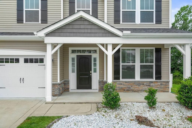 45 Commodore Ct, Cameron, NC 28326 - doorway to property featuring stone siding, a porch, an attached garage, and concrete driveway