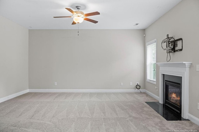 45 Commodore Ct, Cameron, NC 28326 - unfurnished living room featuring a ceiling fan, a fireplace with flush hearth, and carpet flooring