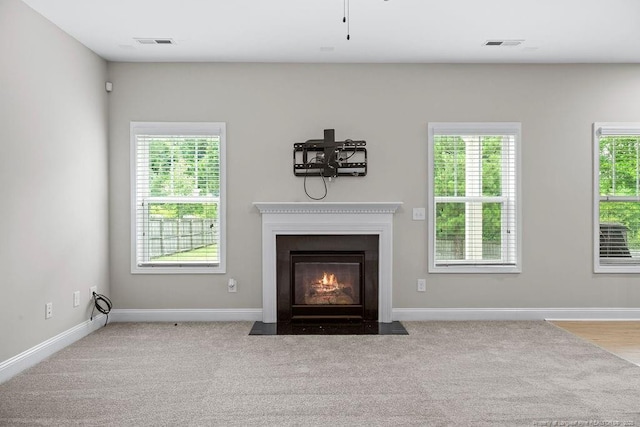 45 Commodore Ct, Cameron, NC 28326 - detailed view of a fireplace with flush hearth and carpet flooring