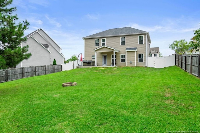 45 Commodore Ct, Cameron, NC 28326 - rear view of property with an outdoor fire pit and a fenced backyard