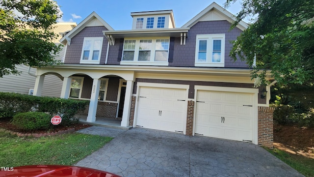 523 Front Ridge Dr, Cary, NC 27519 - craftsman inspired home featuring covered porch, driveway, brick siding, and a garage