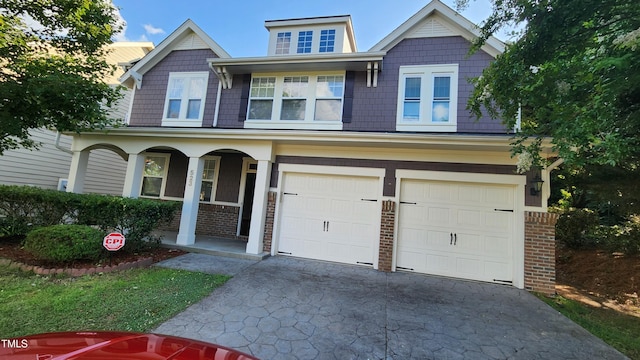 523 Front Ridge Dr, Cary, NC 27519 - craftsman inspired home with an attached garage, driveway, covered porch, and brick siding