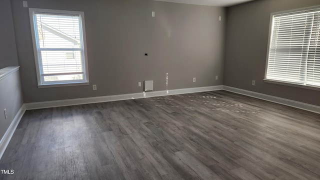 523 Front Ridge Dr, Cary, NC 27519 - empty room with dark wood-style flooring and baseboards
