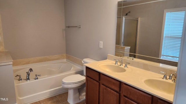 523 Front Ridge Dr, Cary, NC 27519 - bathroom with a bath, double vanity, a shower with shower door, and tile patterned floors