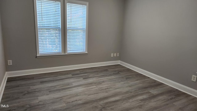 523 Front Ridge Dr, Cary, NC 27519 - spare room with dark wood-type flooring and baseboards