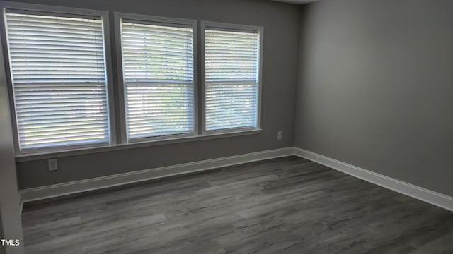 523 Front Ridge Dr, Cary, NC 27519 - spare room with dark wood finished floors and baseboards