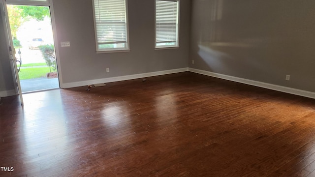 523 Front Ridge Dr, Cary, NC 27519 - unfurnished room with dark wood-style floors and plenty of natural light