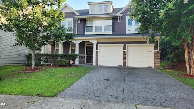 523 Front Ridge Dr, Cary, NC 27519 - craftsman inspired home with concrete driveway, a garage, a front yard, covered porch, and brick siding
